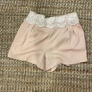 Pink shorts with lace trim